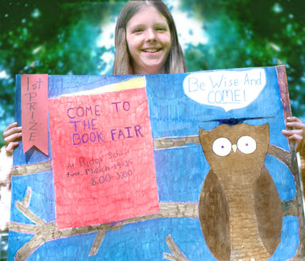 Debbie (age 11) holding her poster advertising the Book Fair